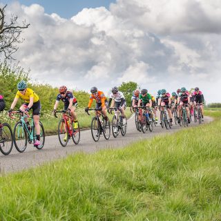 The peloton under the water tower near bedford