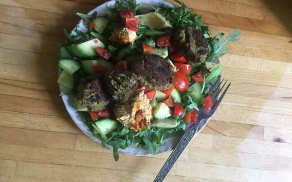 a picture of homemade falafel salad on a wooden work surface